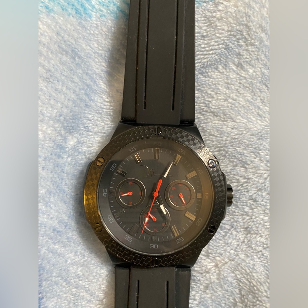 This is a black Marc Anthony sport watch with rubber band.